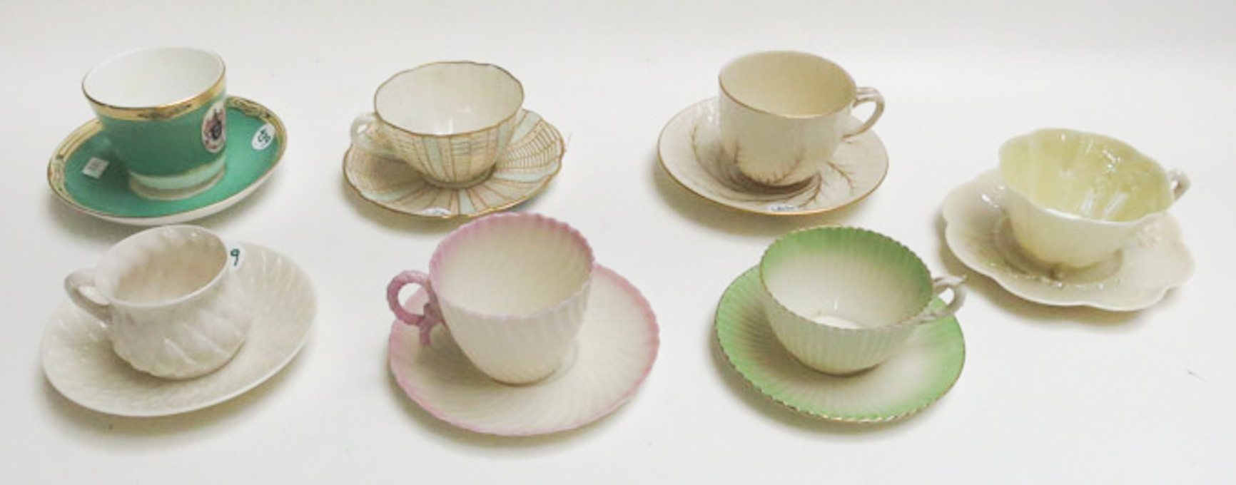 Appraisal: SEVEN BELLEEK CUP AND SAUCERS in various patterns such as