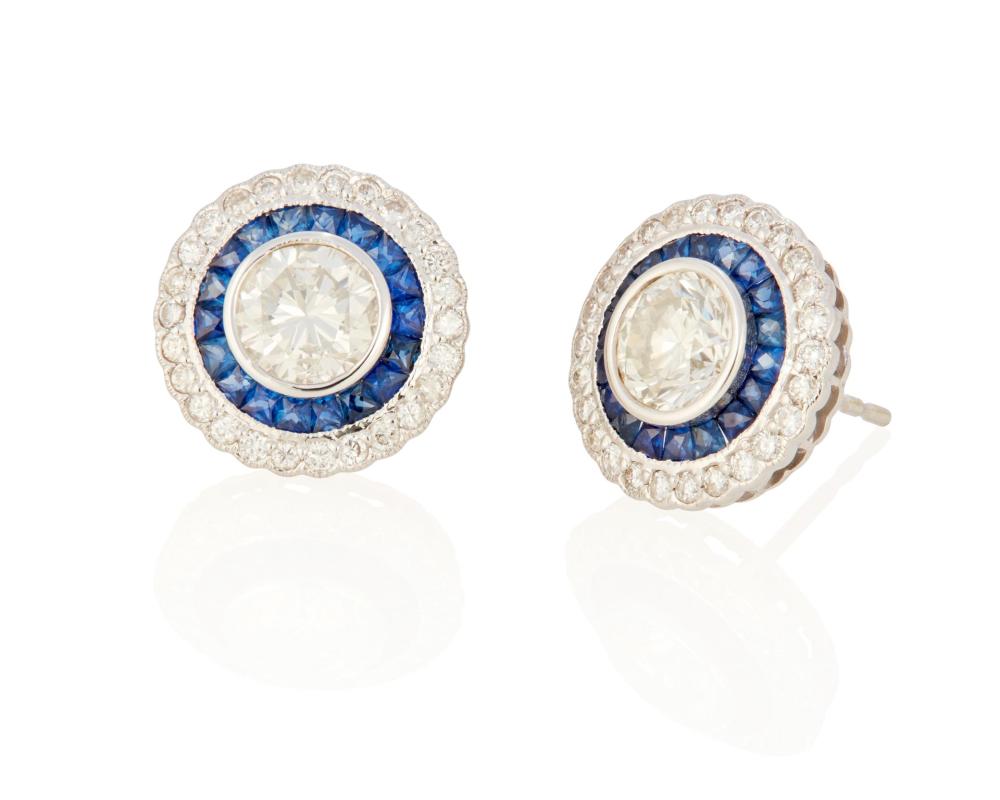 Appraisal: A PAIR OF DIAMOND AND SAPPHIRE EARRINGSA pair of diamond