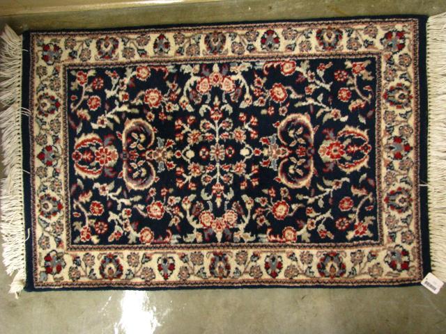 Appraisal: Indo-Oriental x Mat blue red and ivory field dominant ivory