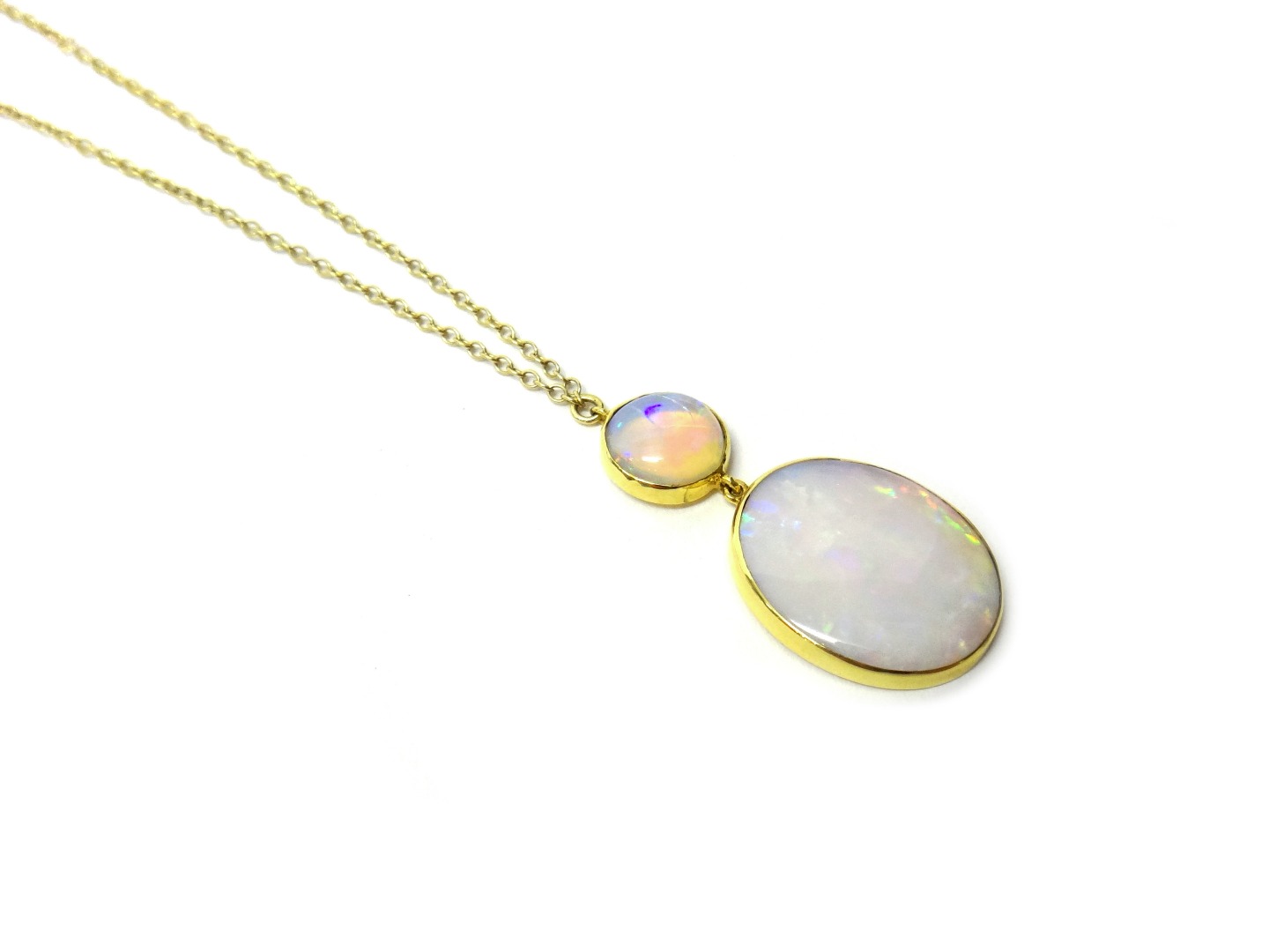 Appraisal: An opal pendant necklace yellow metal mounted with a circular