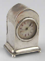 Appraisal: A silver miniature clock by Mappin and Webb with gothic