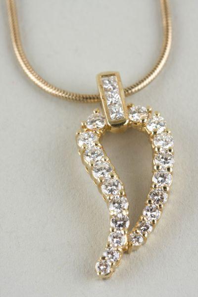 Appraisal: KT Yellow Gold and Diamond Leaf Motif Pendant with chain