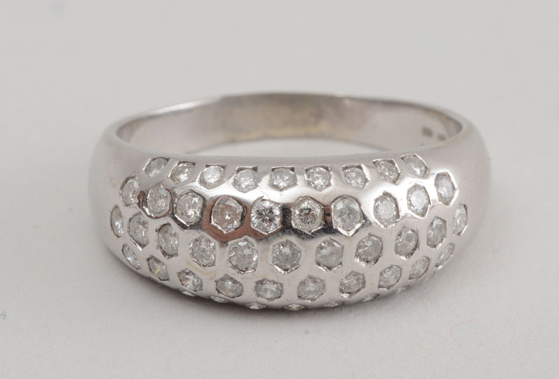 Appraisal: K WHITE GOLD AND DIAMOND BOMB STYLE RING Containing a