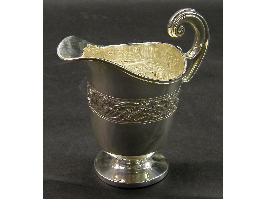 Appraisal: George V Irish silver helmet shaped milk jug with embossed