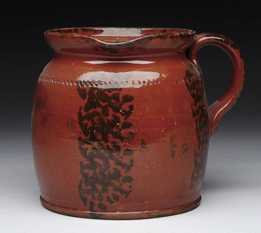 Appraisal: GOOD DECORATED REDWARE SIDE HANDLED POT Glazed redware pot with