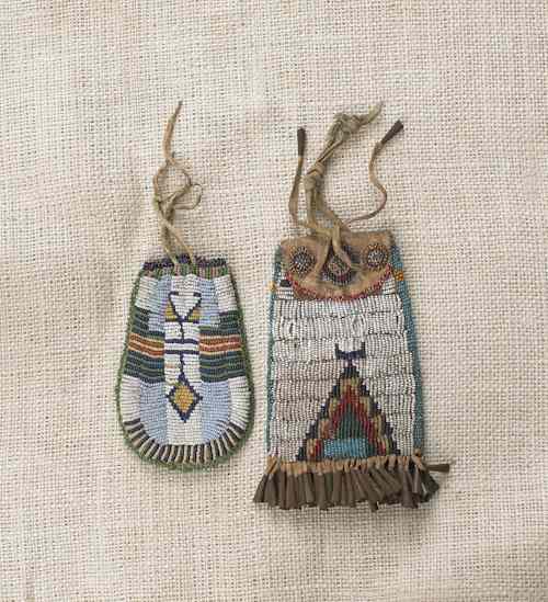 Appraisal: Sioux beaded hide pouch with tin tinklers l together with