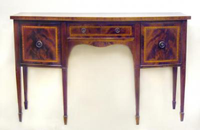 Appraisal: A GEORGE III MAHOGANY SIDEBOARD of bowed form crossbanded with