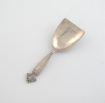 Appraisal: By Georg Jensen a modern Danish caddy spoon with a