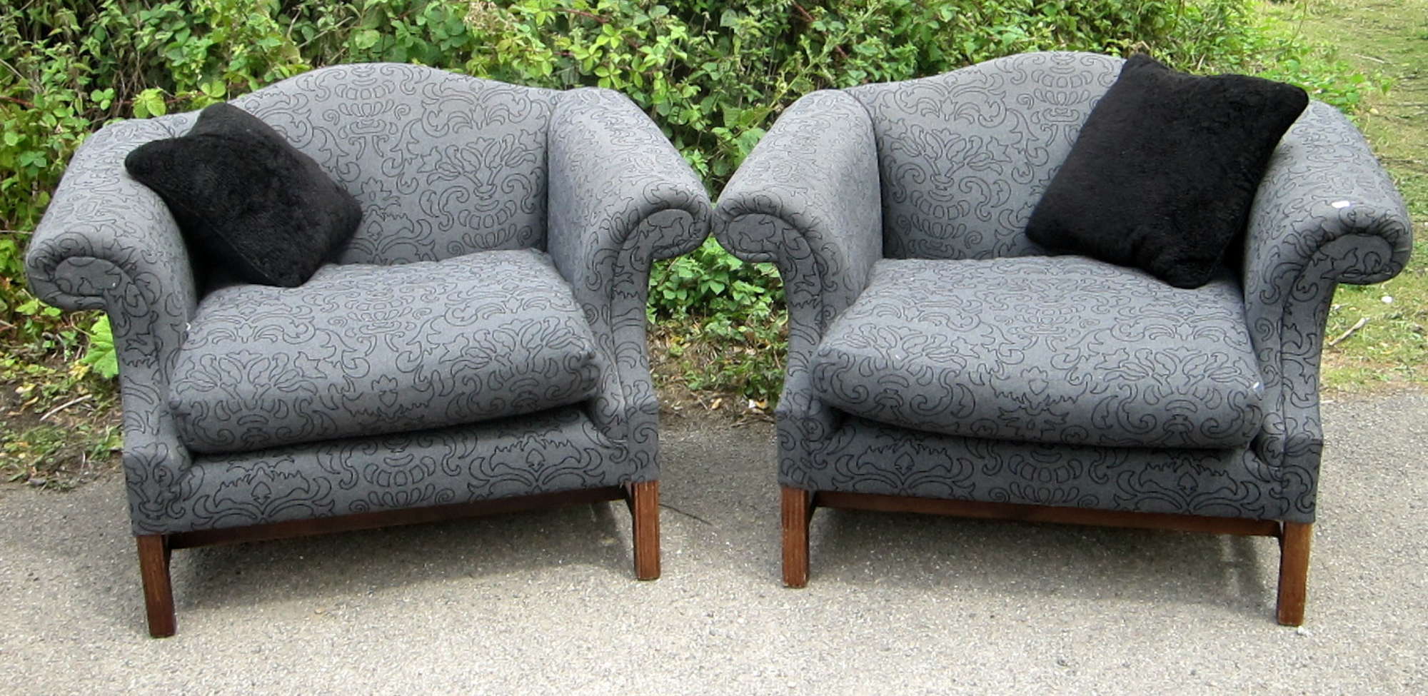 Appraisal: Pair of grey upholstered arm chairs with stylised design to