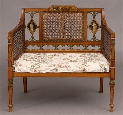 Appraisal: EDWARDIAN PAINTED SATINWOOD SETTEE The stepped top rail with floral