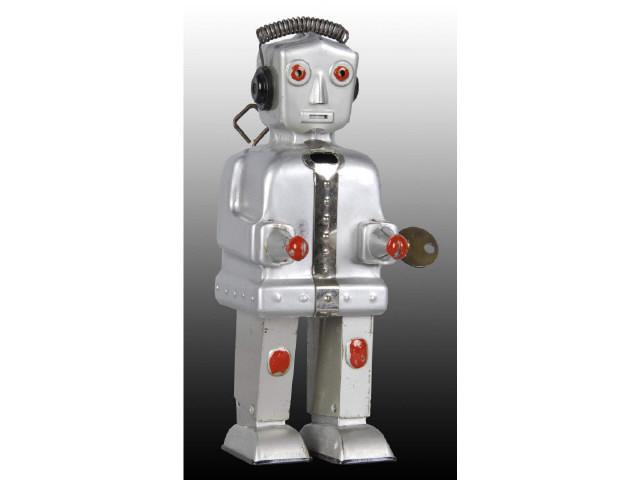 Appraisal: German Tin Wind-Up Robot Toy Description Silver Needs flint to