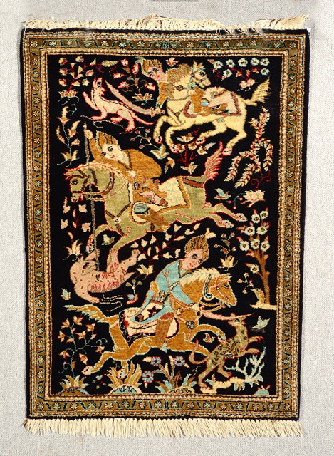 Appraisal: A PERSIAN QUM MIDNIGHT BLUE GROUND SILK MAT decorated huntsmen