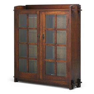 Appraisal: GUSTAV STICKLEY Double-door bookcase EUROPEAN ARTS CRAFTS Bookcase desk EUROPEAN