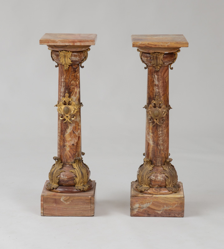 Appraisal: PAIR OF NAPOLEON III GILT-BRONZE-MOUNTED AGATE PEDESTALS The square tops