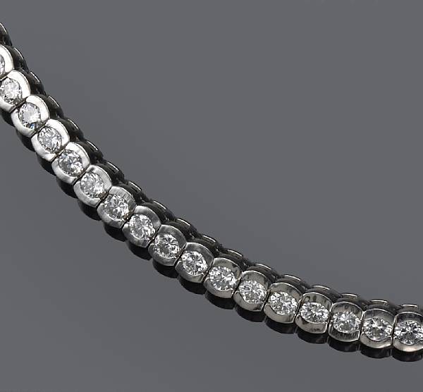 Appraisal: A diamond and platinum line bracelet estimated total diamond weight