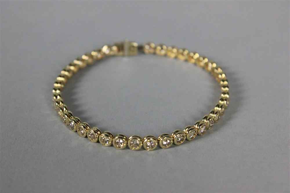 Appraisal: LADY'S DIAMOND AND YELLOW GOLD LINE BRACELET comprised of a