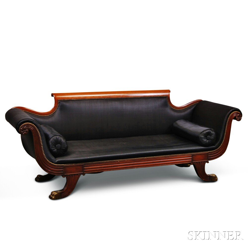 Appraisal: Classical-style Carved Mahogany Upholstered Sofa the scrolled back over reeded