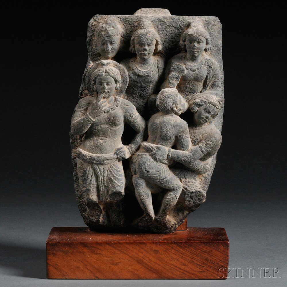 Appraisal: Gandharan-style Gray Schist Frieze carved with a haloed figure on