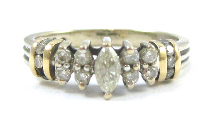 Appraisal: DIAMOND AND FOURTEEN KARAT GOLD RING The white and yellow