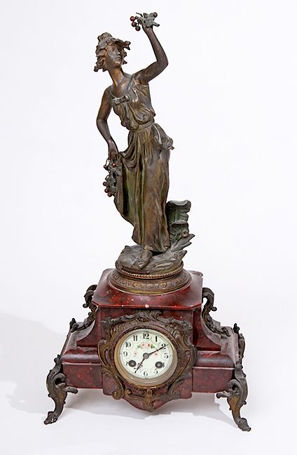 Appraisal: French Figural Clock A spelter figural clock with a decorated