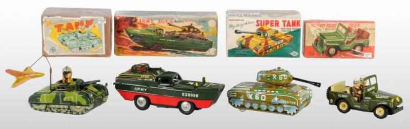 Appraisal: Lot of Tin Military Vehicle Friction Toys Description Japanese Working