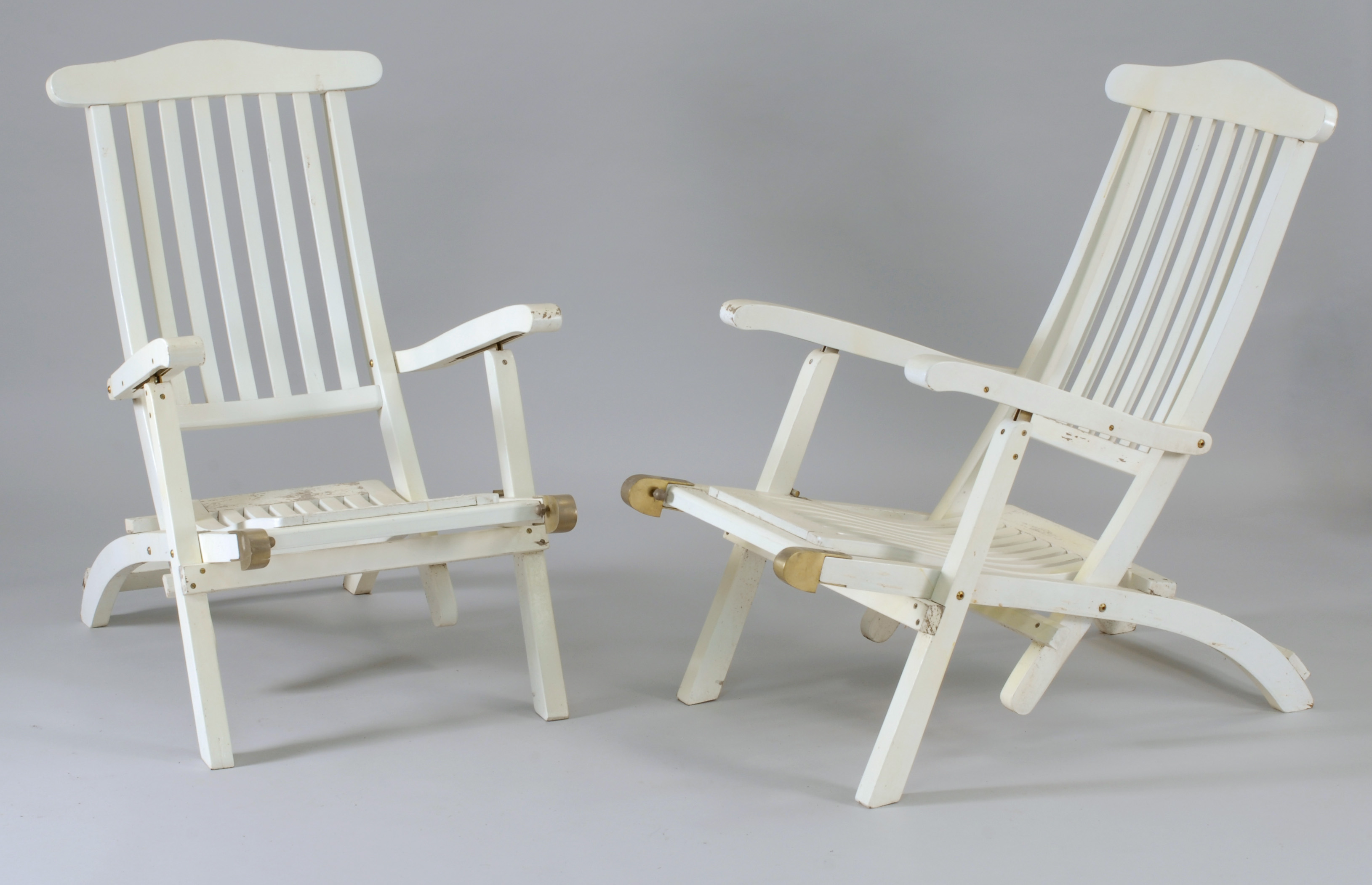 Appraisal: PAIR OF TH CENTURY OCEAN LINER-STYLE DECK CHAIRS Painted white