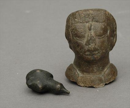 Appraisal: Southeast Asian Carved Stone Head Together with a small iron