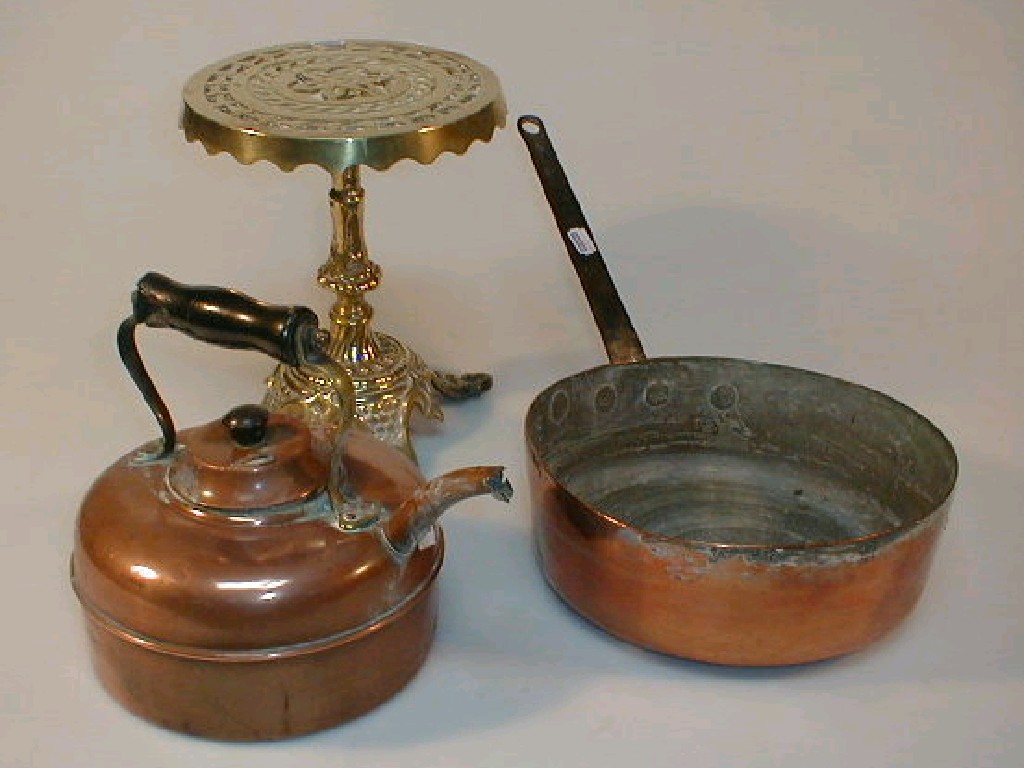 Appraisal: A heavy brass kettle stand Victorian copper kettle and a