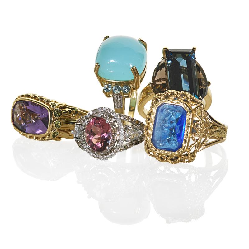 Appraisal: COLLECTION OF RECENT GEM-SET GOLD RINGS Five pieces Carved blue