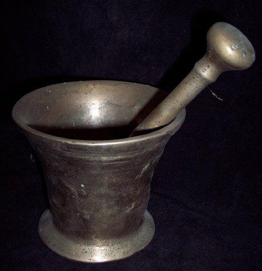 Appraisal: A bronze mortar and pestle the mortar with dragon detail