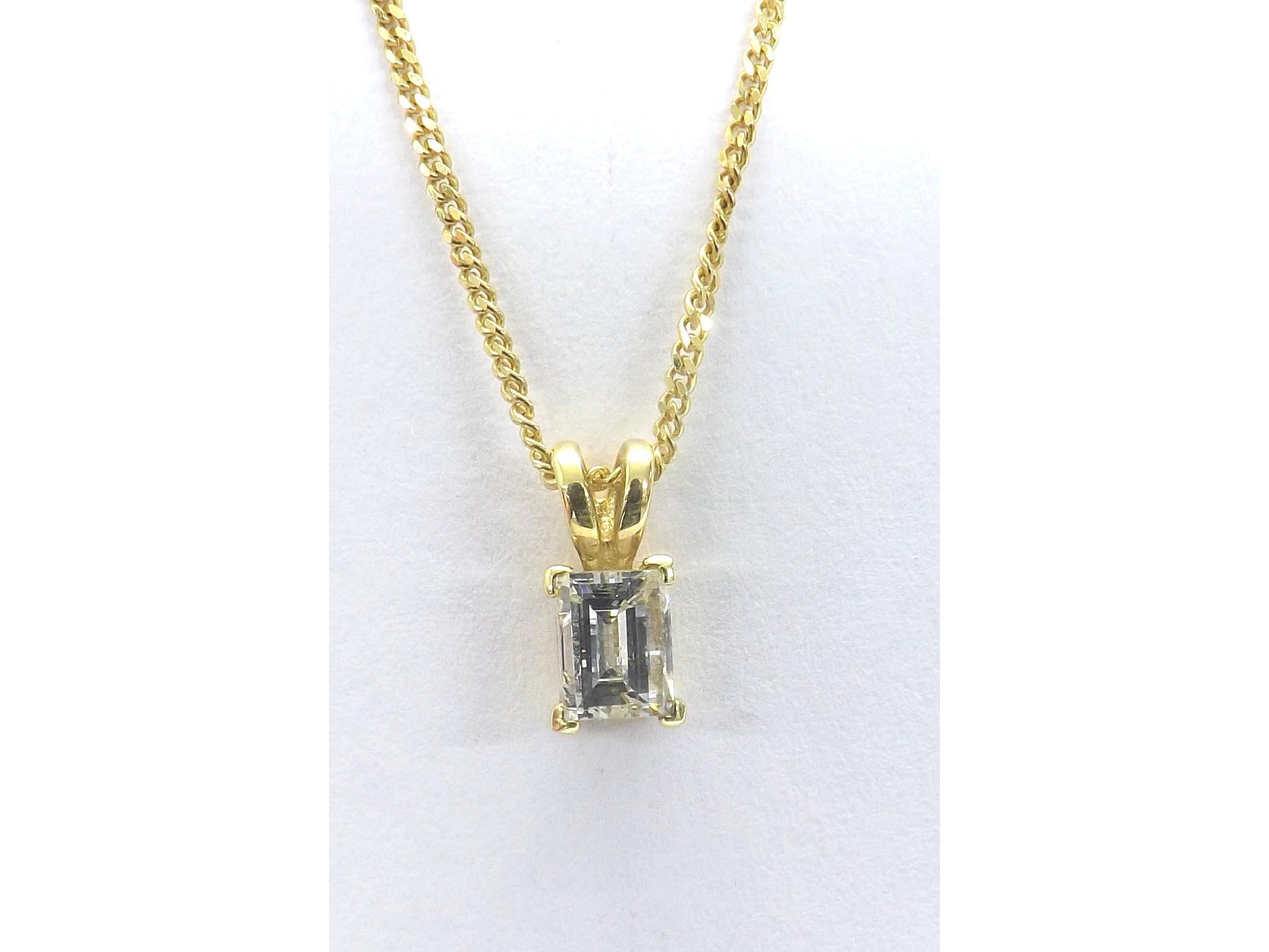 Appraisal: - -a ct yellow gold emerald-cut diamond pendant on necklace