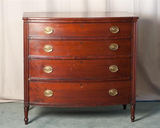 Appraisal: A Sheraton-style Mahogany Bow Front Chest of Drawers with pine