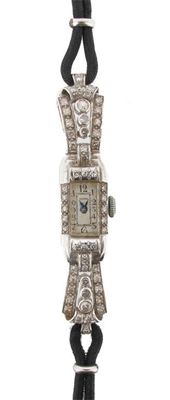 Appraisal: A ladies diamond set platinum wristwatch Black chord band