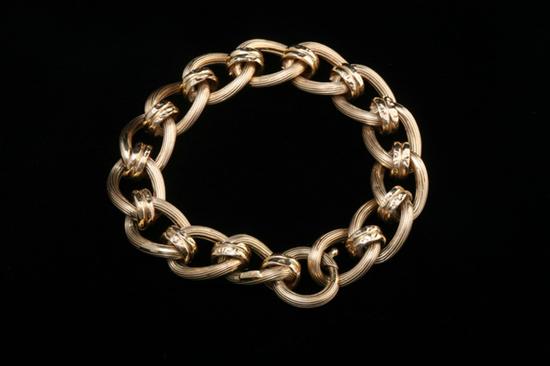 Appraisal: K YELLOW GOLD FLEXIBLE LINK BRACELET Ribbed oval links joined