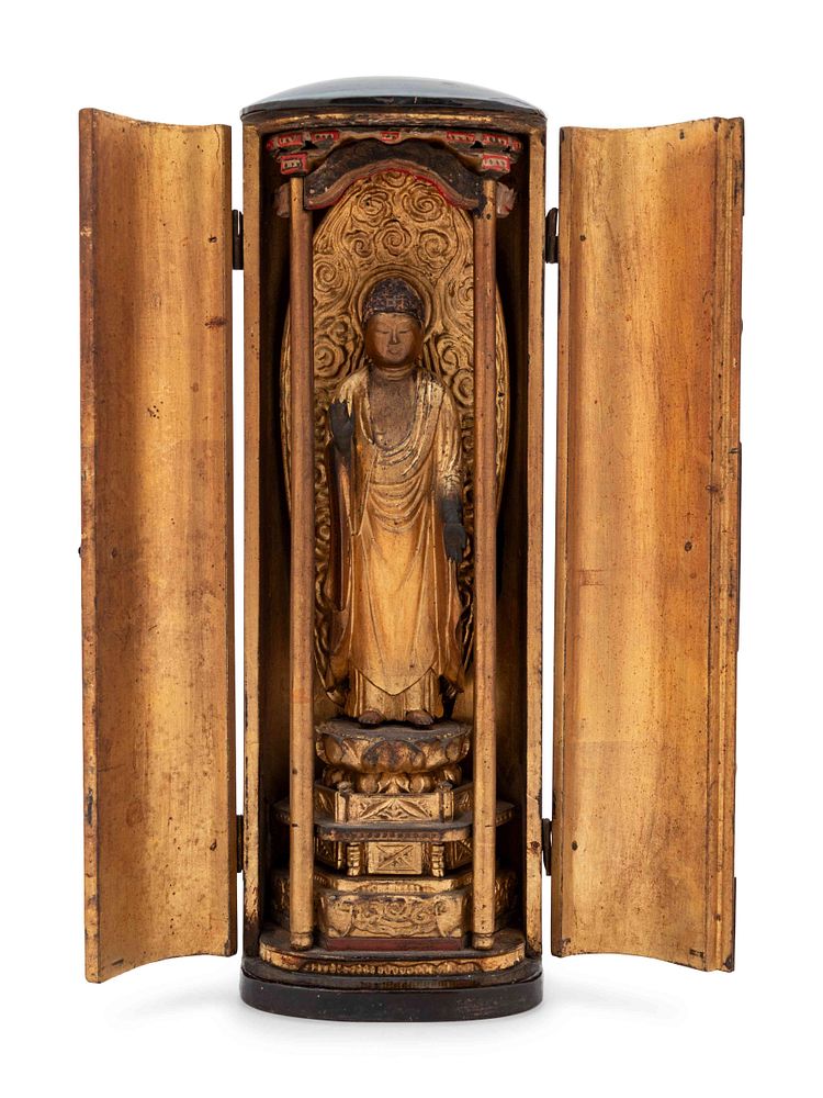 Appraisal: A Black and Gilt Lacquered Wood Shrine with a Gilt