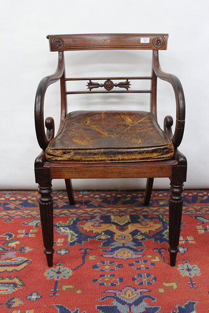 Appraisal: A REGENCY ROSEWOOD BARBACK CARVER ARMCHAIR with scrolling arms and