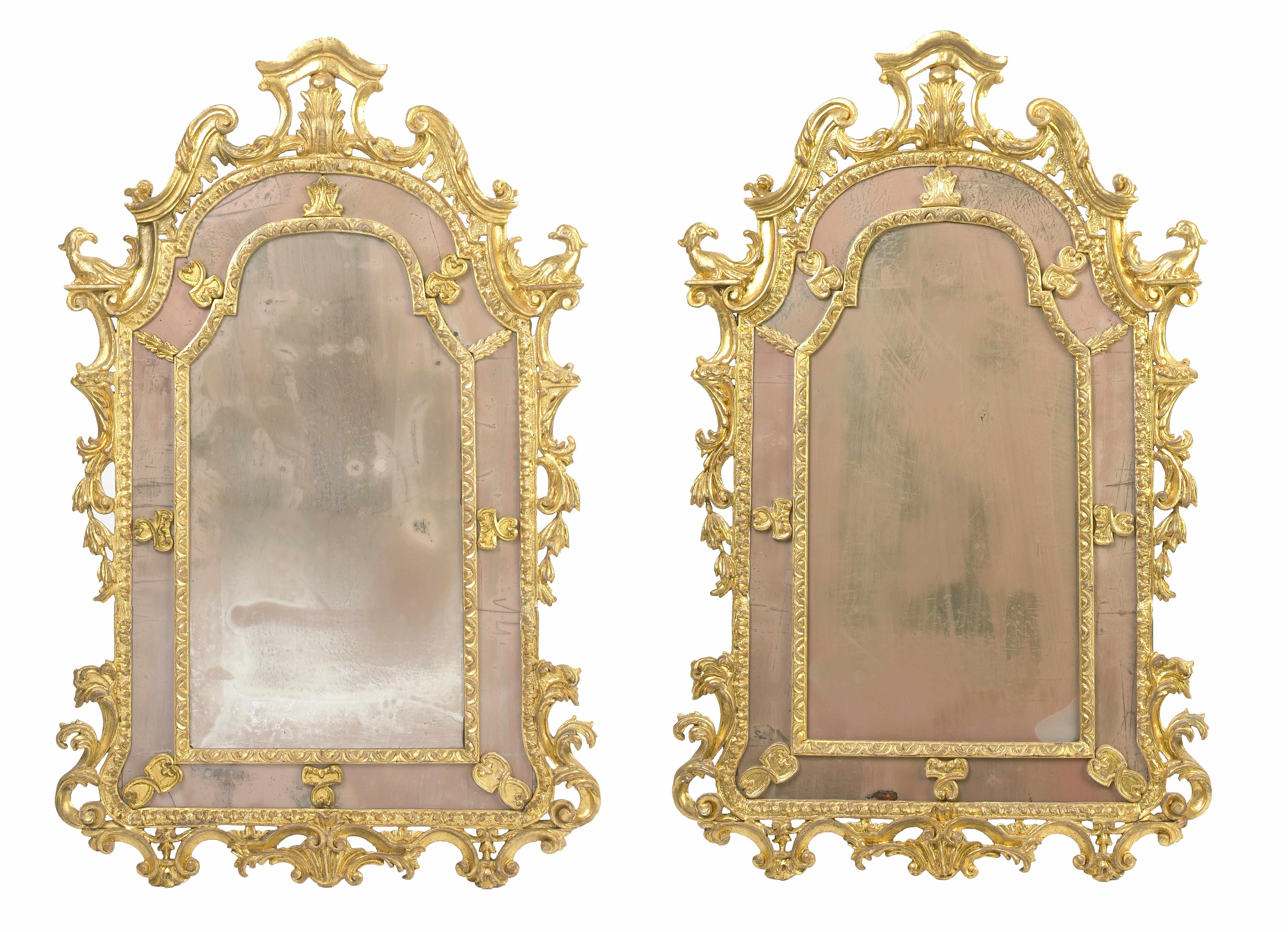 Appraisal: A pair of Italian Baroque style carved giltwood mirrors th