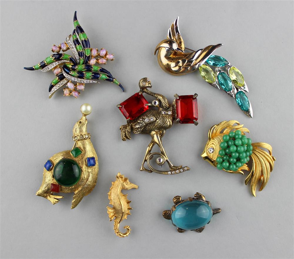 Appraisal: COLLECTION OF ANIMAL PINS a seal pin with a green