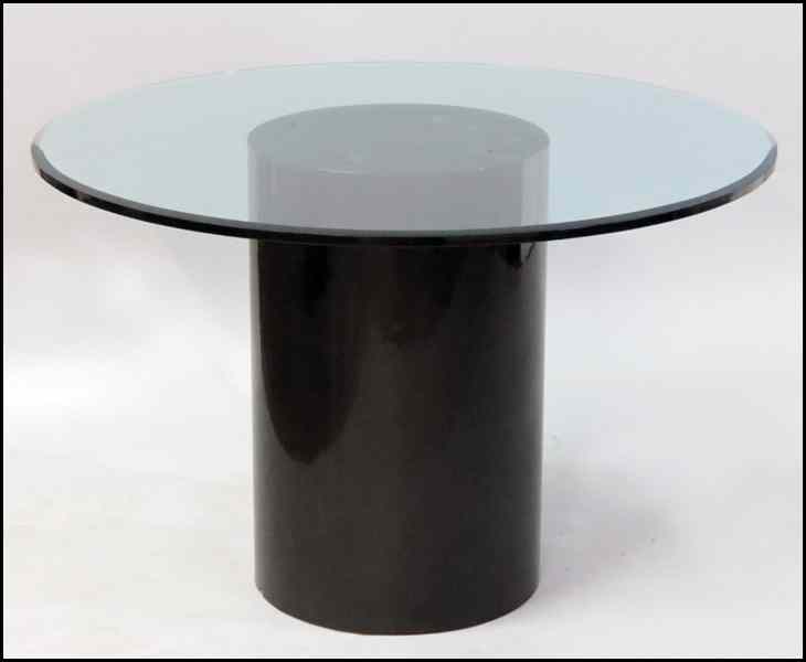 Appraisal: GLASS ROUND TOP TABLE Raised on a laminate pedestal Height