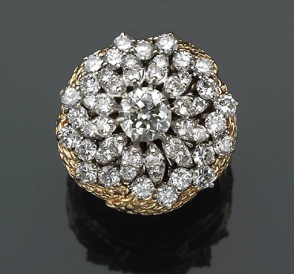 Appraisal: A diamond cluster ring estimated total diamond weight carats mounted