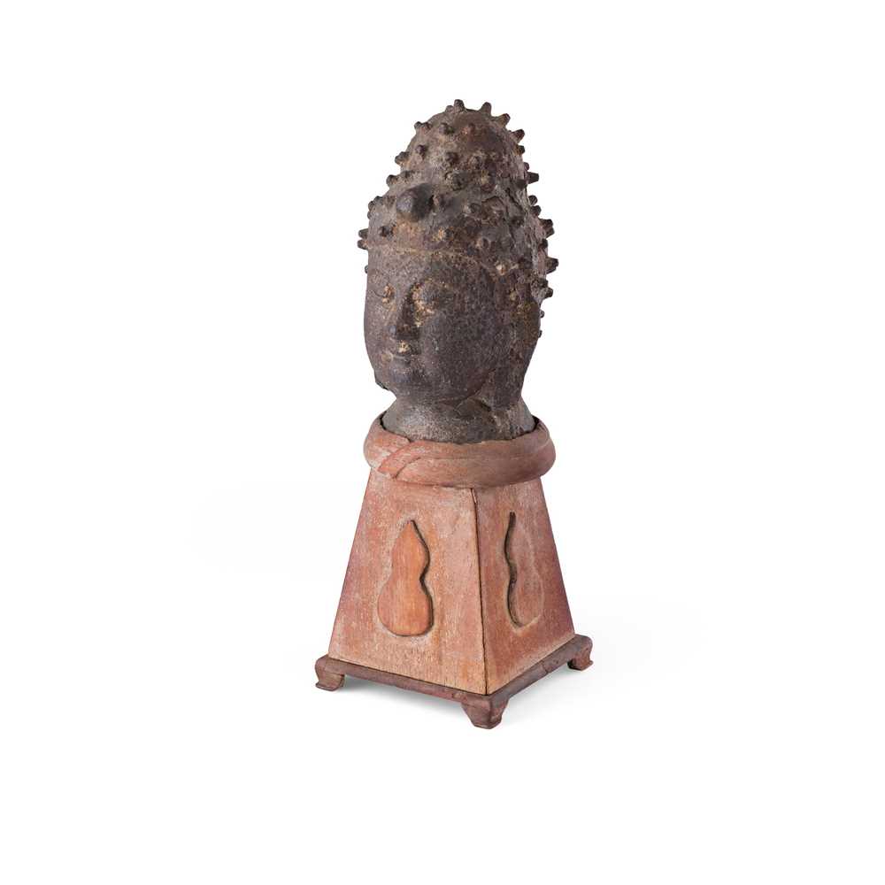 Appraisal: CAST IRON BUDDHA HEAD with stud-like urna above a serene