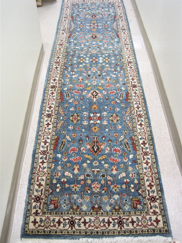 Appraisal: AFGHANI PERSIAN RUNNER overall floral decoration on sky blue ground