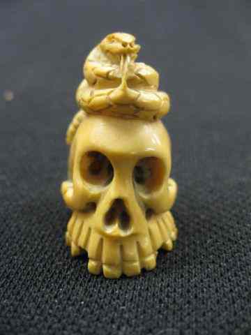 Appraisal: Carved Ivory Netsuke of Snake on Skull '' excellent