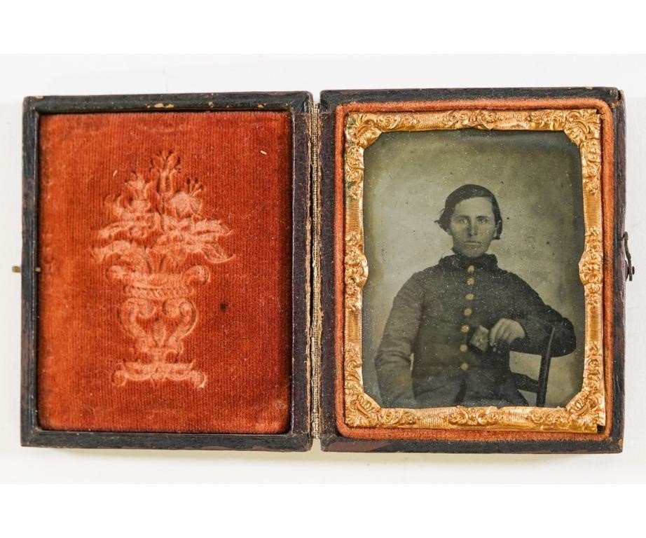 Appraisal: Ambrotype of a Civil War soldier holding a small object