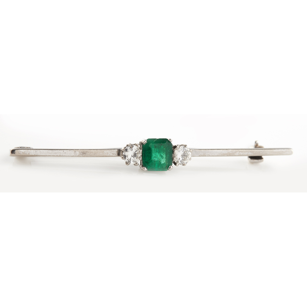 Appraisal: An emerald and diamond set bar brooch claw set with