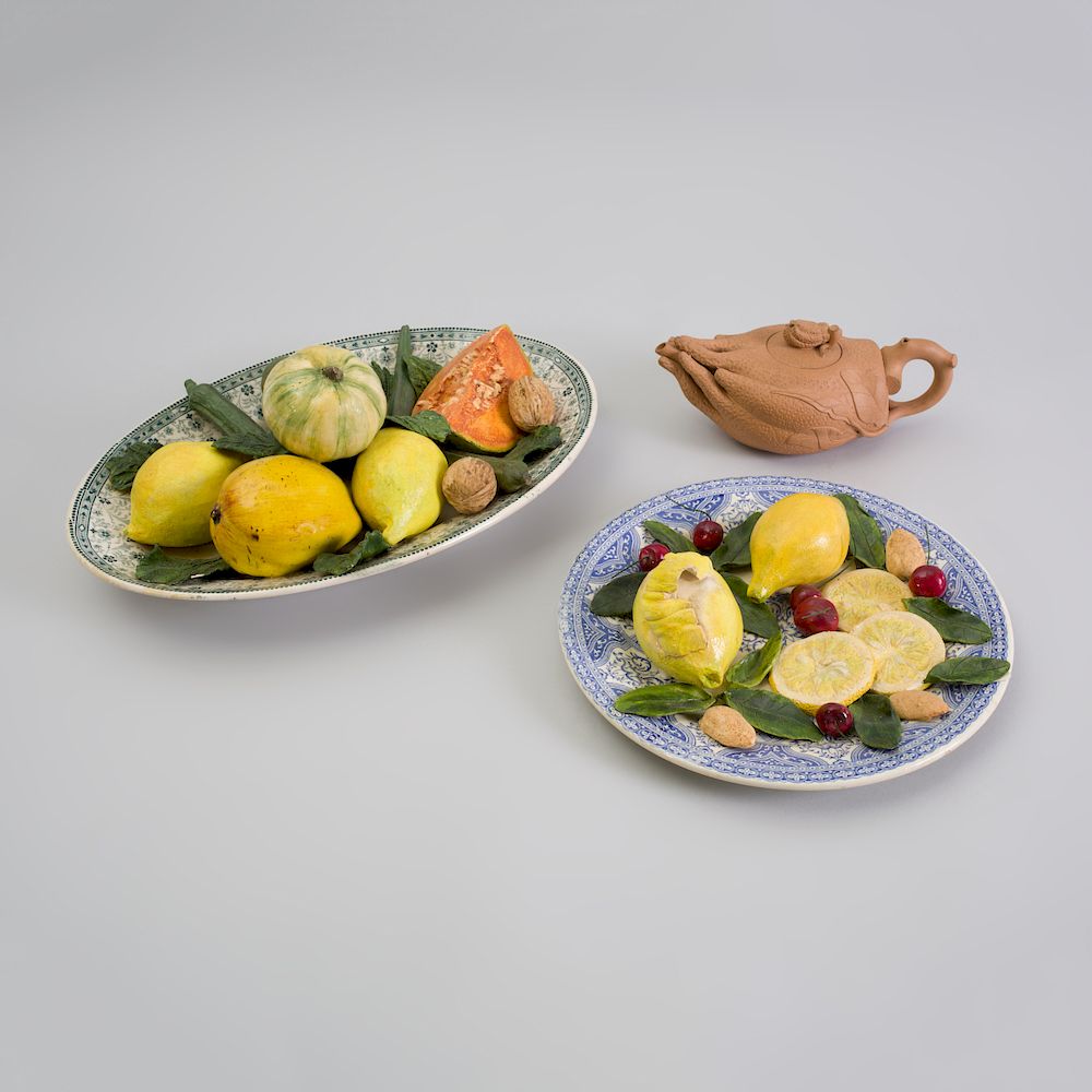 Appraisal: Two French Trompe L'oeil Pattern Plates with Vegetables Christine Viennet