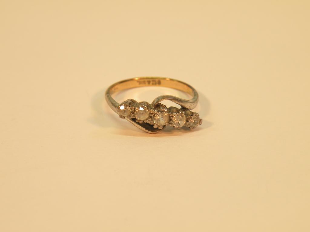 Appraisal: A five stone dress ring with five white stones set