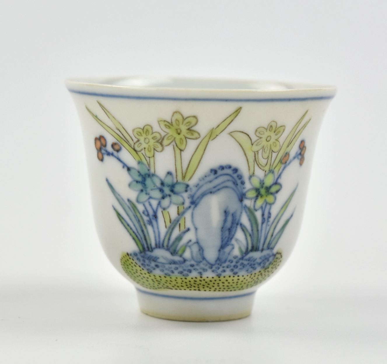 Appraisal: a doucai glazed cup painted with flowering plants and rock