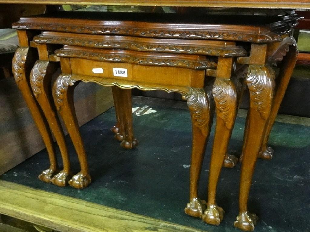 Appraisal: A nest of three graduated good quality walnut occasional tables