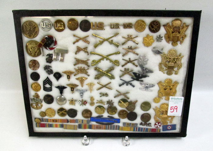 Appraisal: CASE OF U S MILITARY ARMY AND NAVY INSIGNIA four